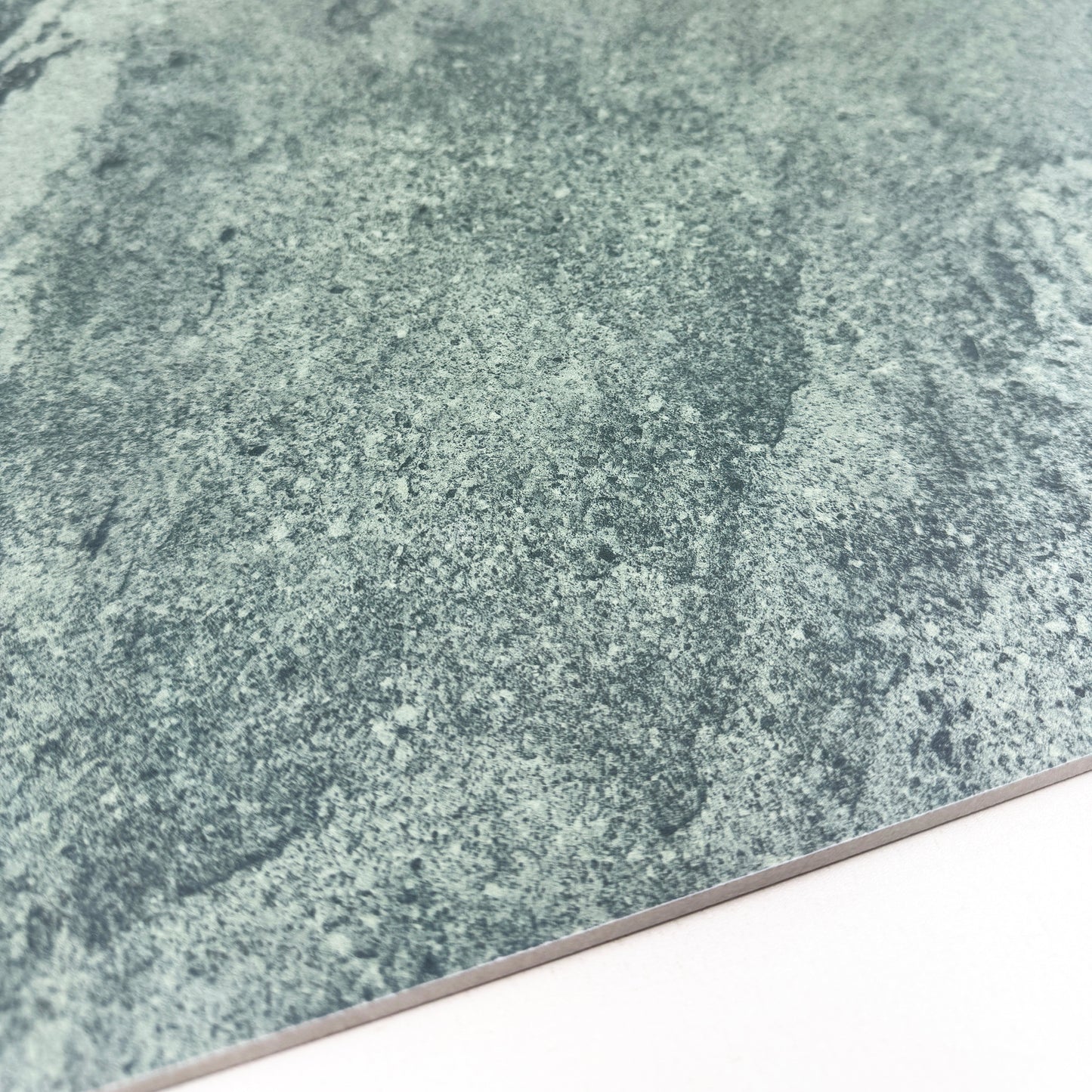 Close-up of a textured green stone surface of sukabumi porcelain tile