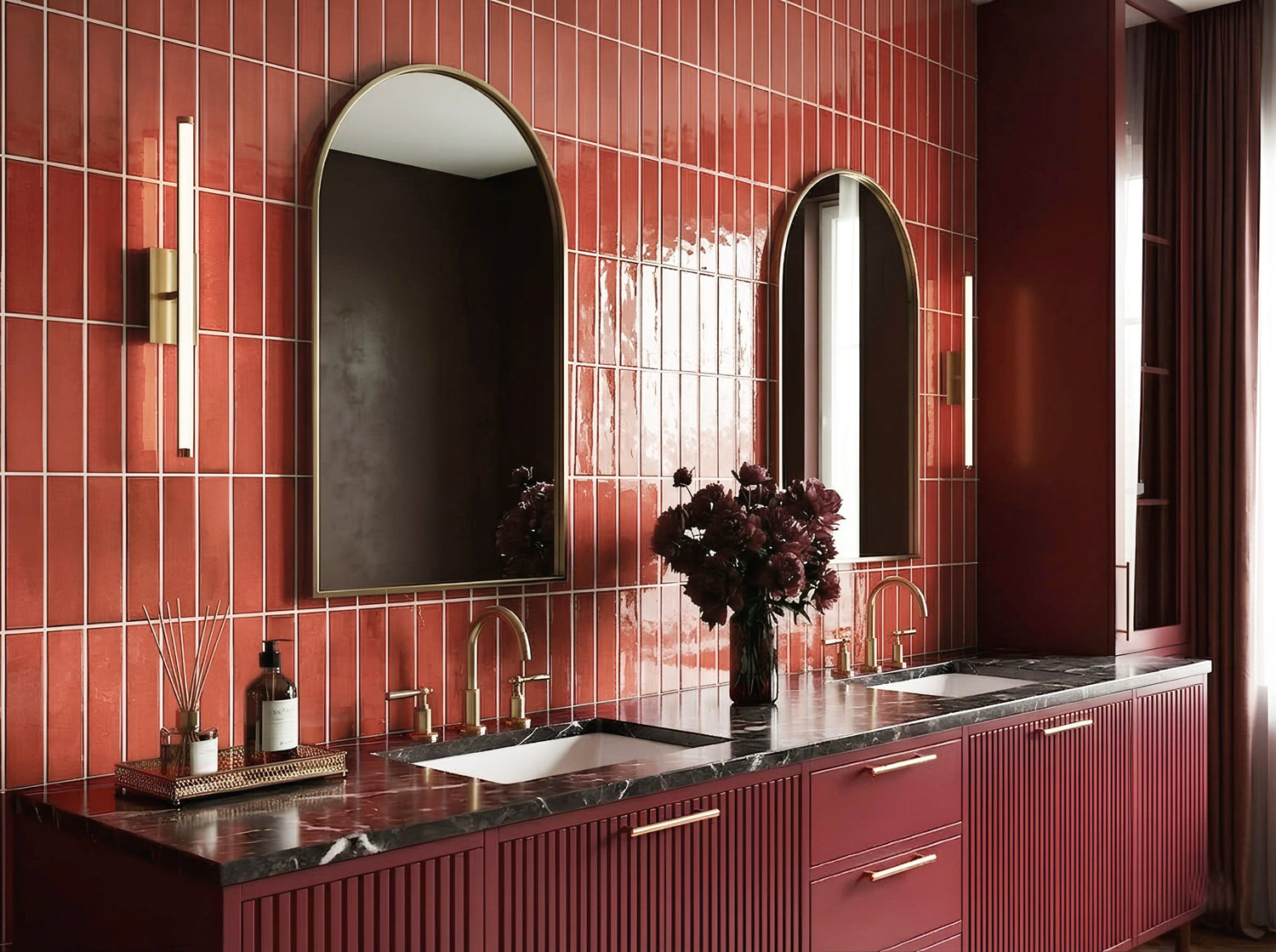 Modern luxury bathroom interior with glossy red indoor wall tiles, double vanity sink, gold fixtures, and elegant mirror design by Roman Mosaic, premium indoor tile supplier UAE.