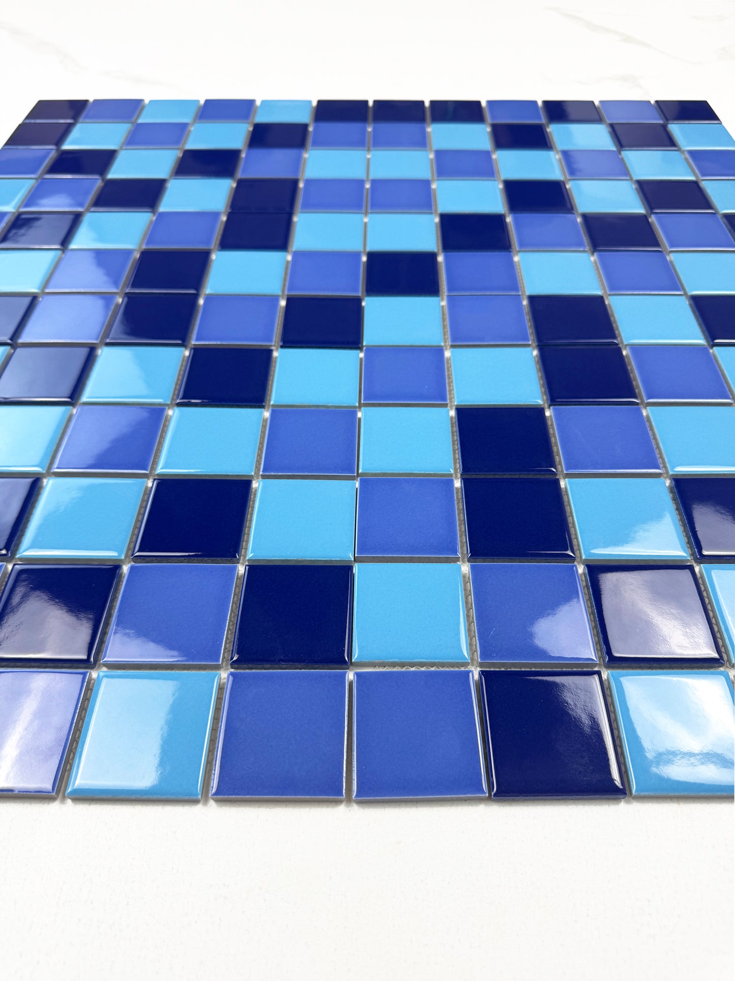 Blue mosaic tiles on a white background