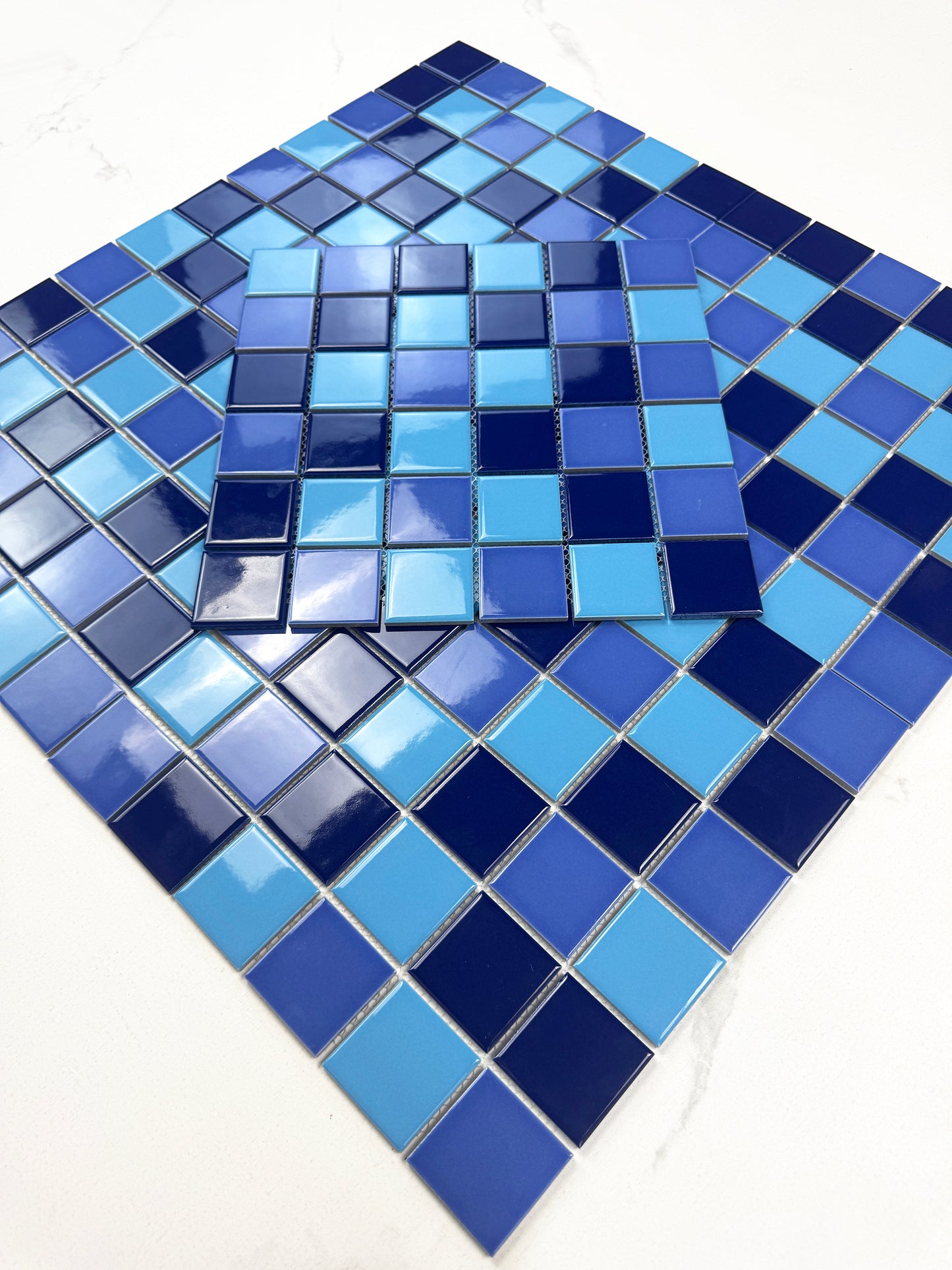 Blue mosaic tiles on a white background