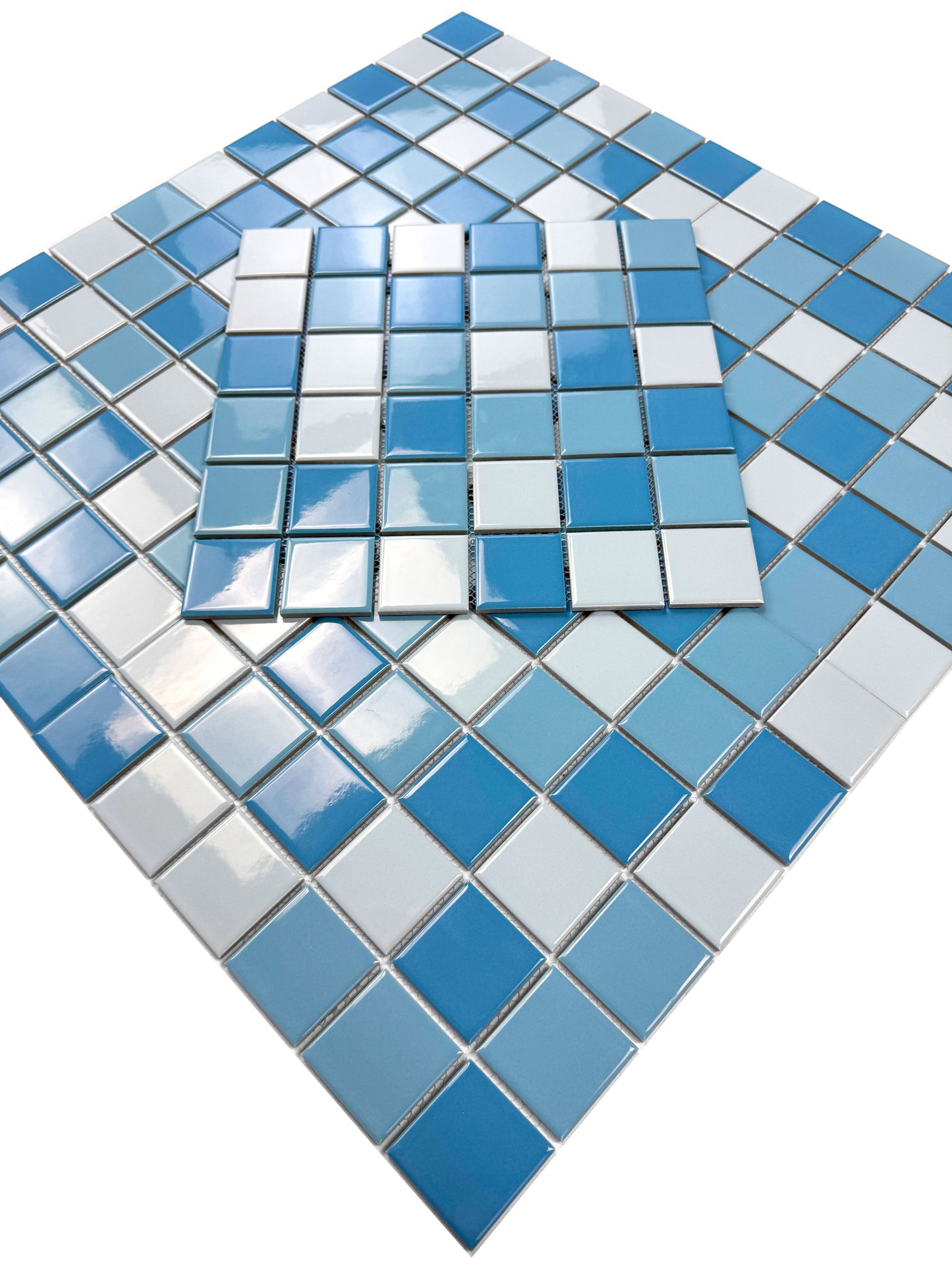 Blue and white mosaic tiles on a white background