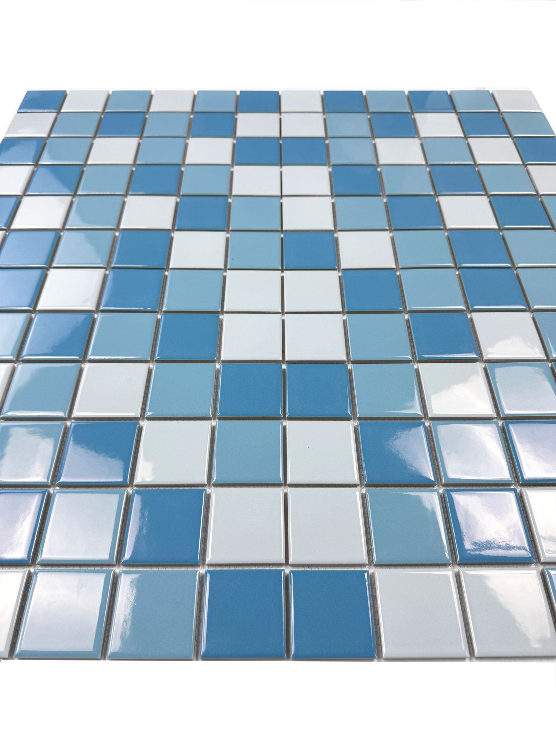Blue and white square tile mosaic on a white background