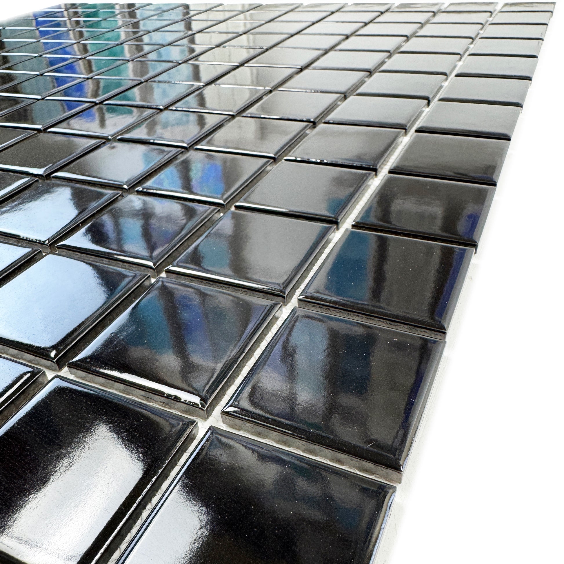 Close-up of black square tiles with reflective surface