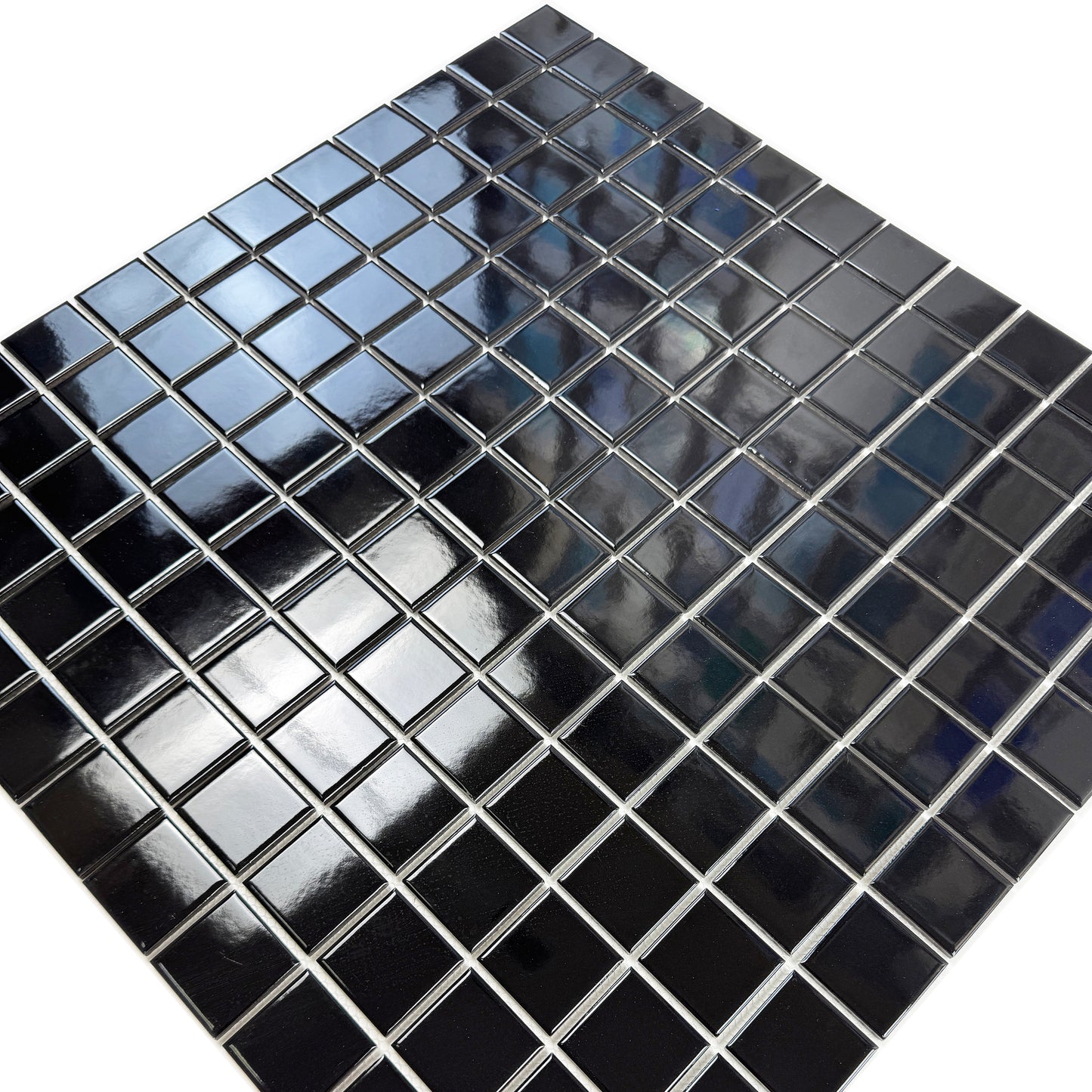 Black square tiles with reflective surface on a white background