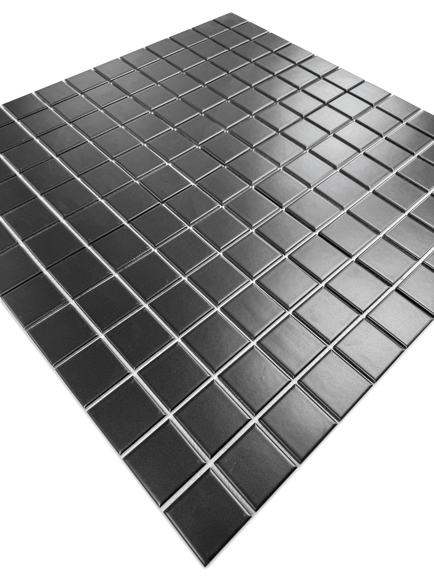 Black square tiles arranged in a grid pattern on a white background