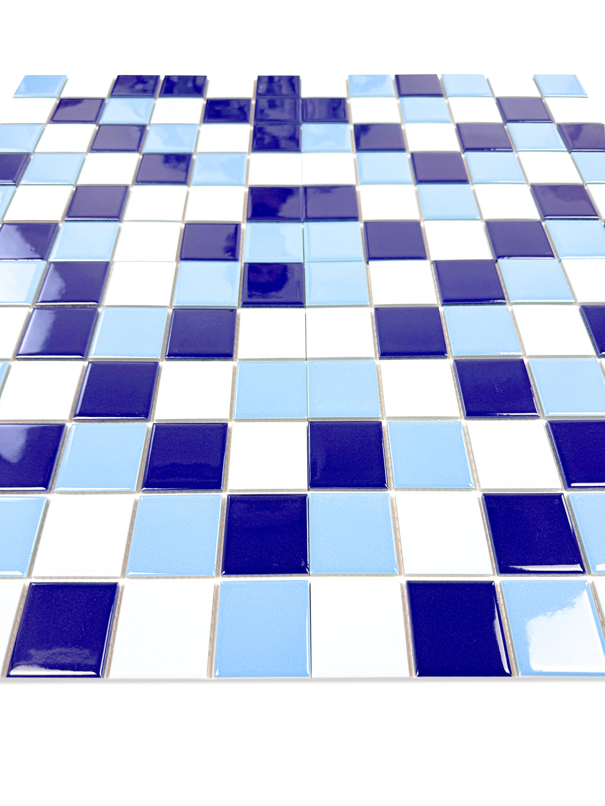 Checkerboard pattern of blue, white, and light blue tiles on a white background