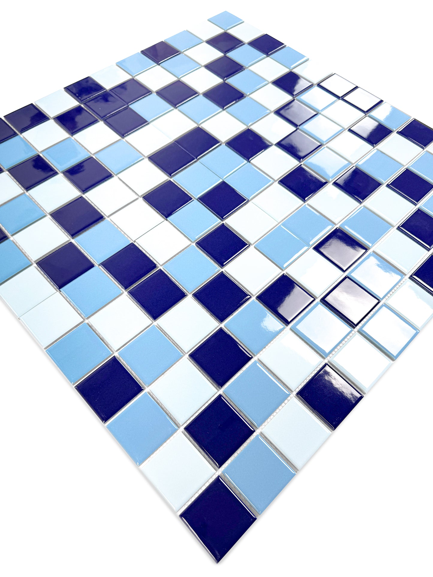 Mosaic tile pattern with blue and white squares on a white background