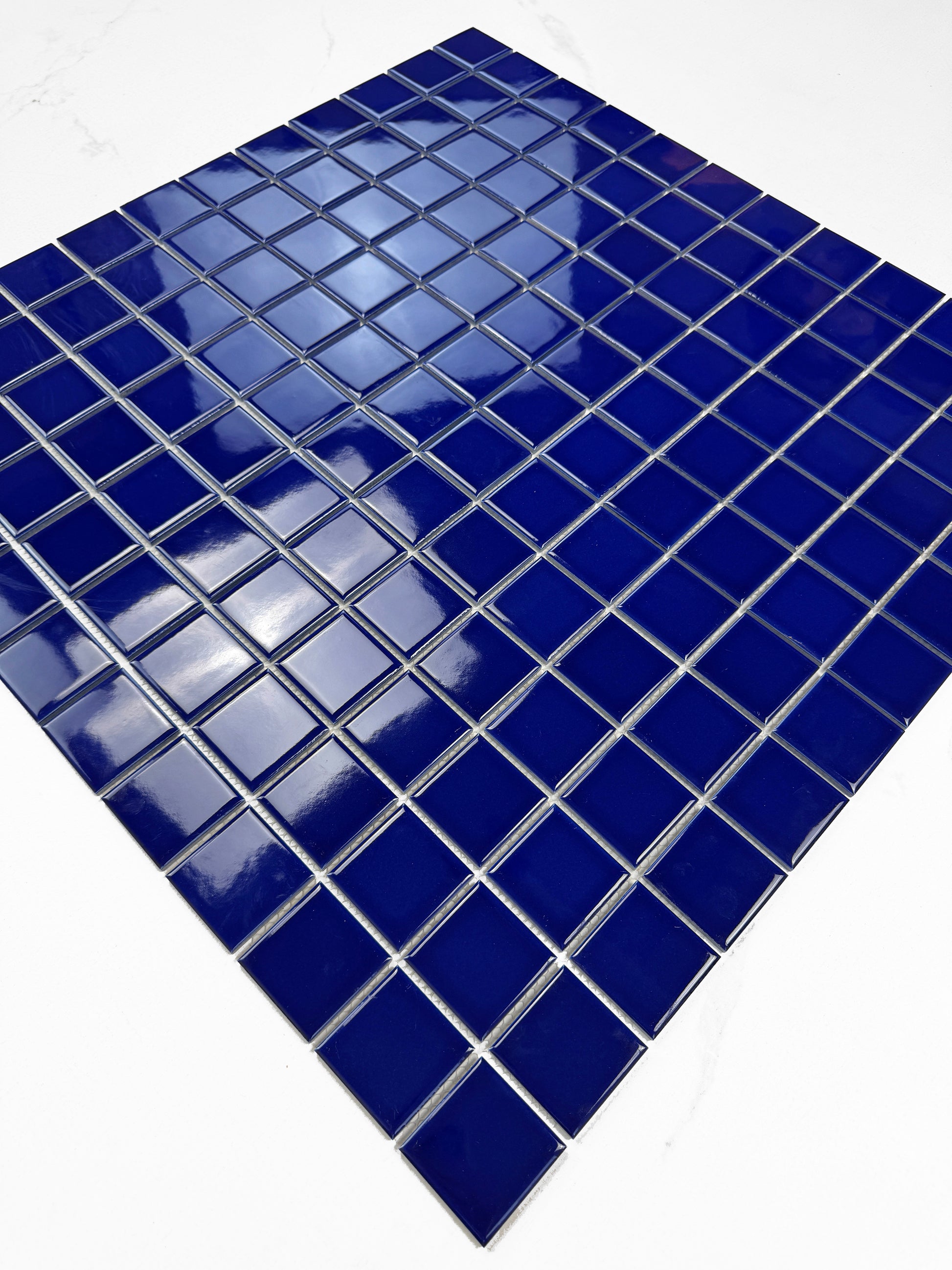 Blue mosaic tile on a white background