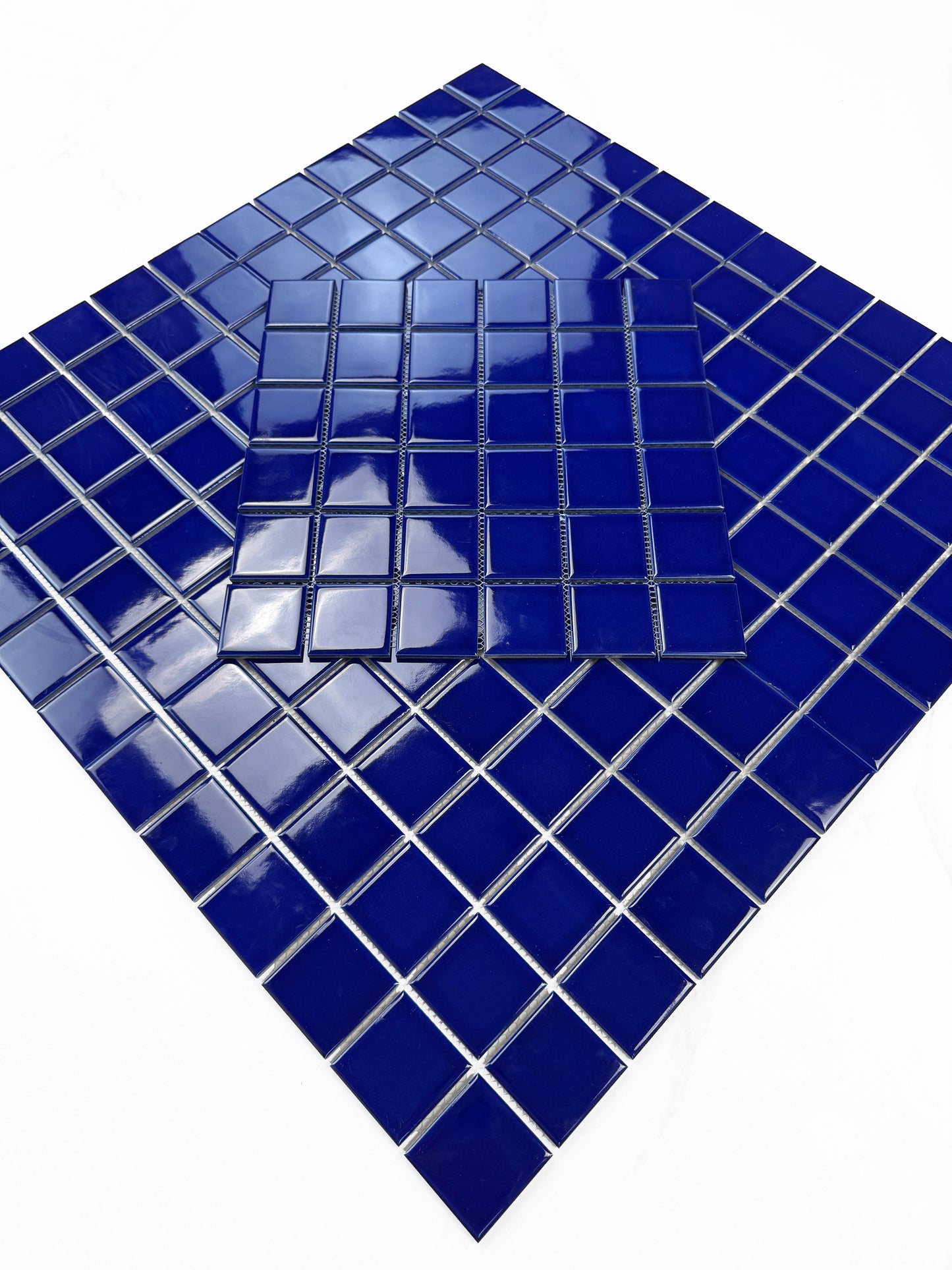 Blue mosaic tile on a white background