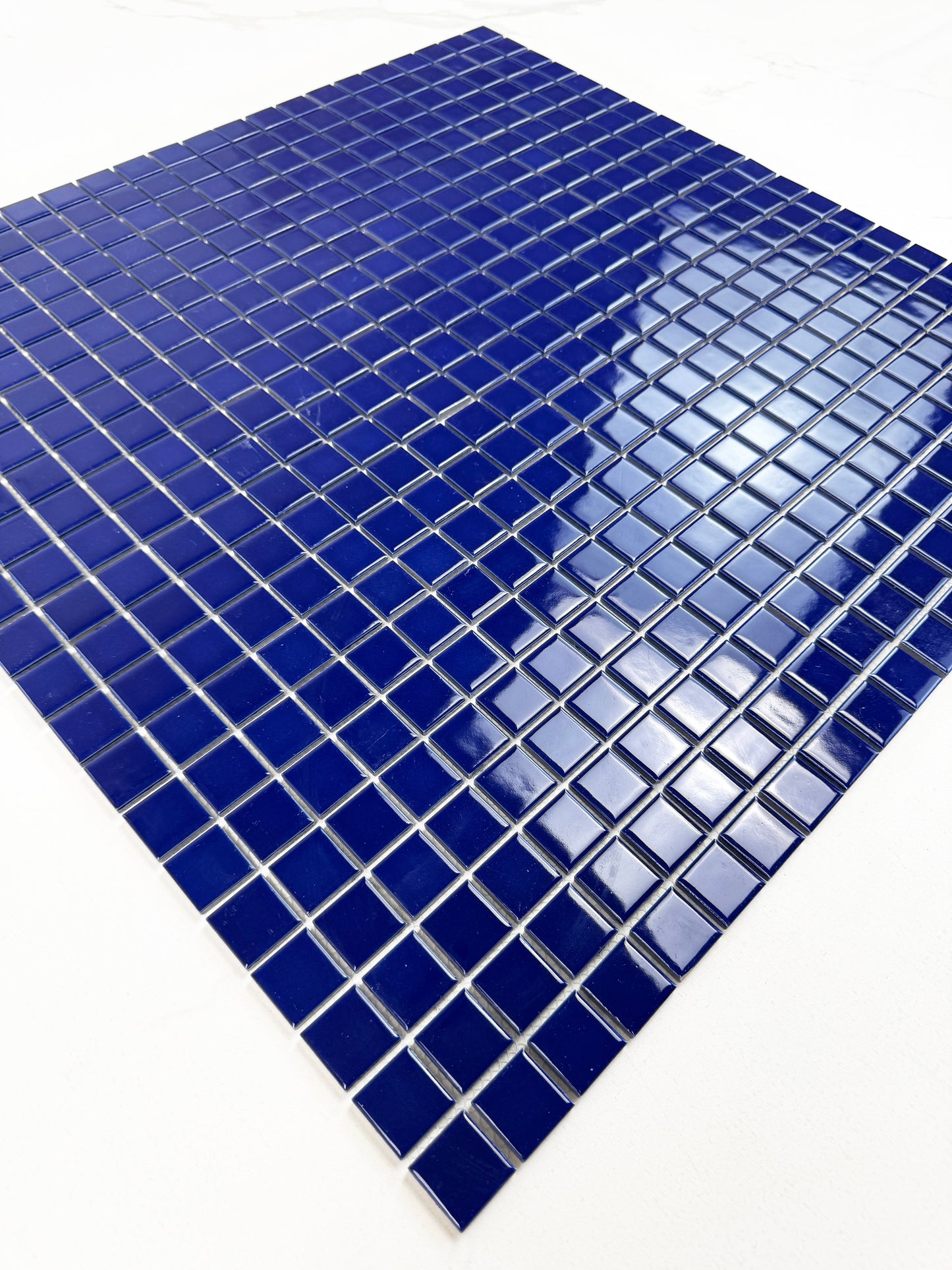 Blue mosaic tile sheet on a white background