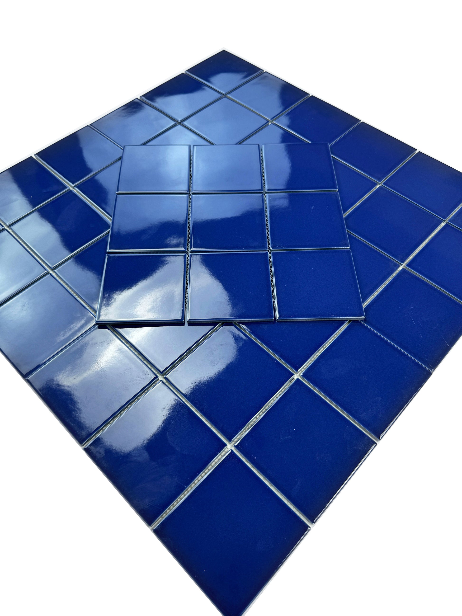  blue mosaic tiles on a white background