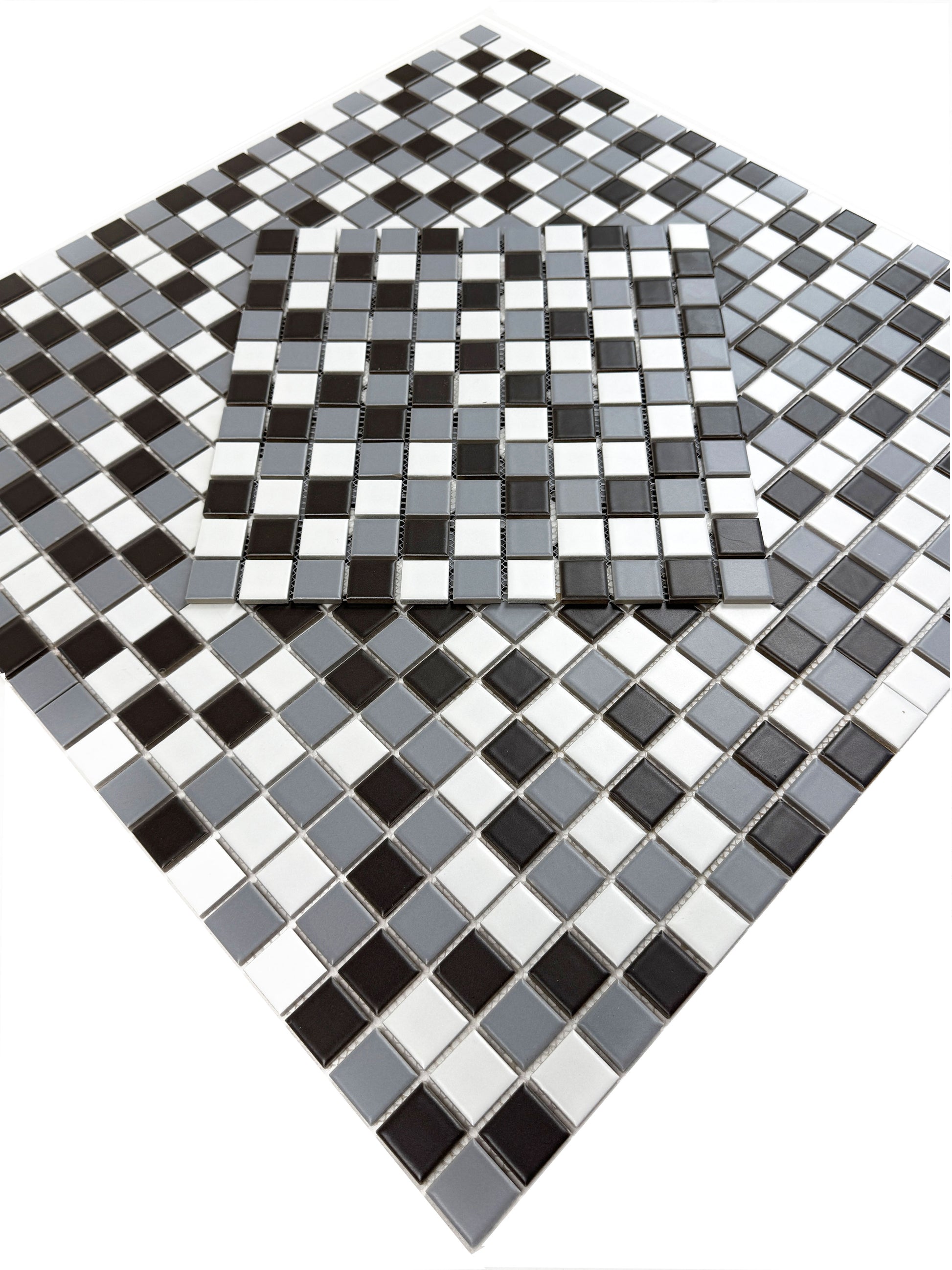 Black, white, and gray mosaic tiles on a white background