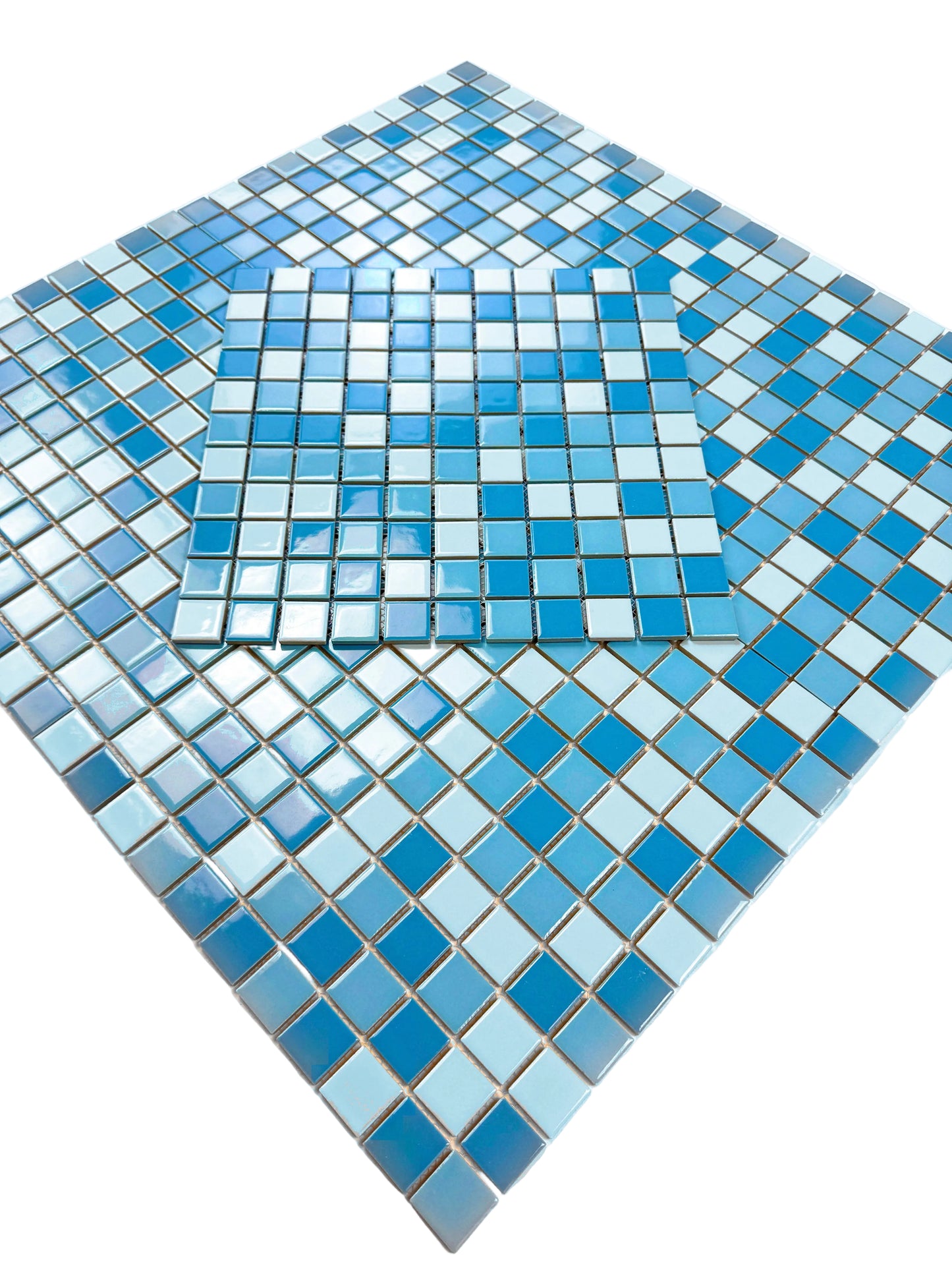 Blue and white mosaic tiles on a white background