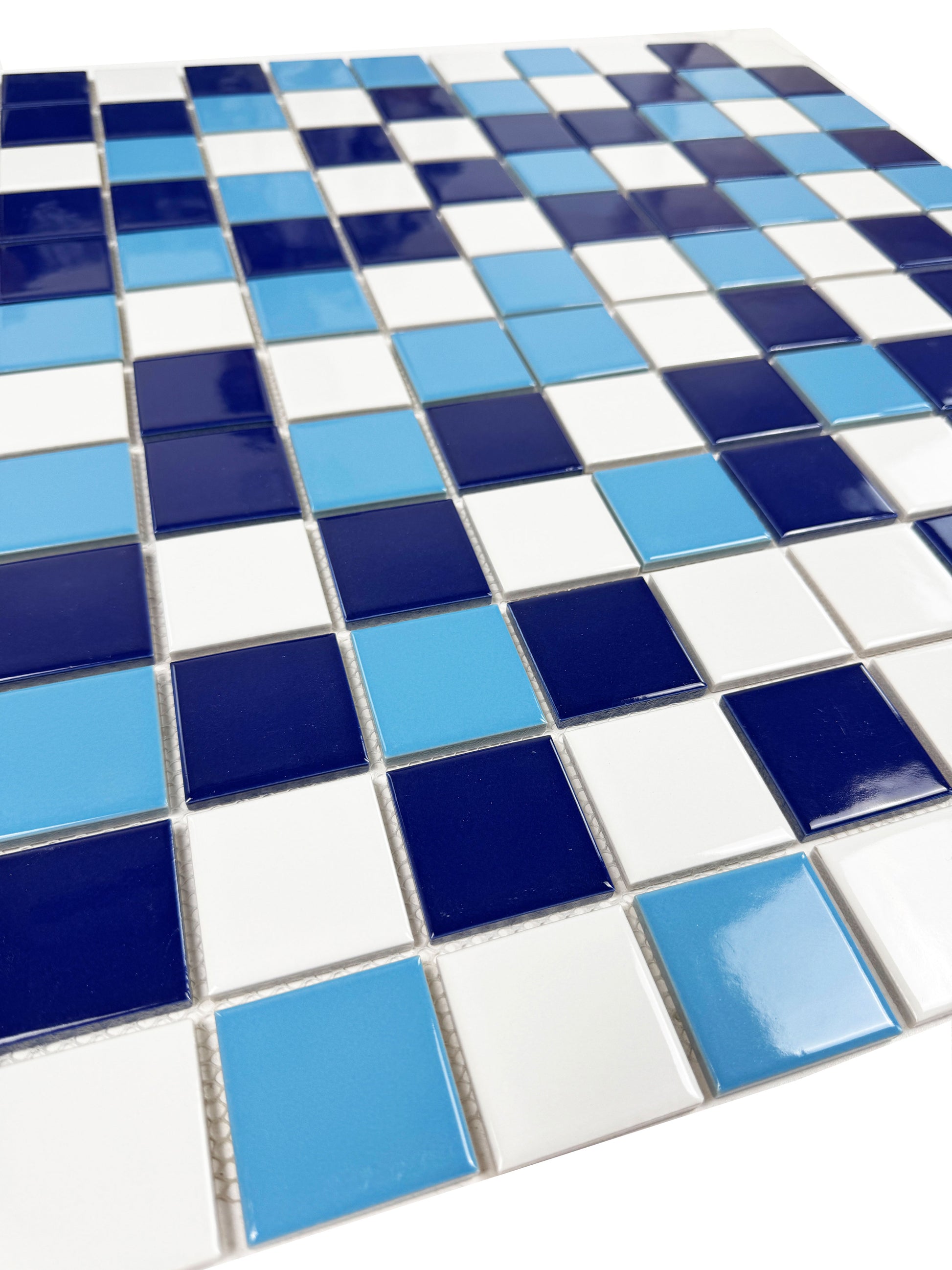 Mosaic pattern of blue, white, and light blue tiles.