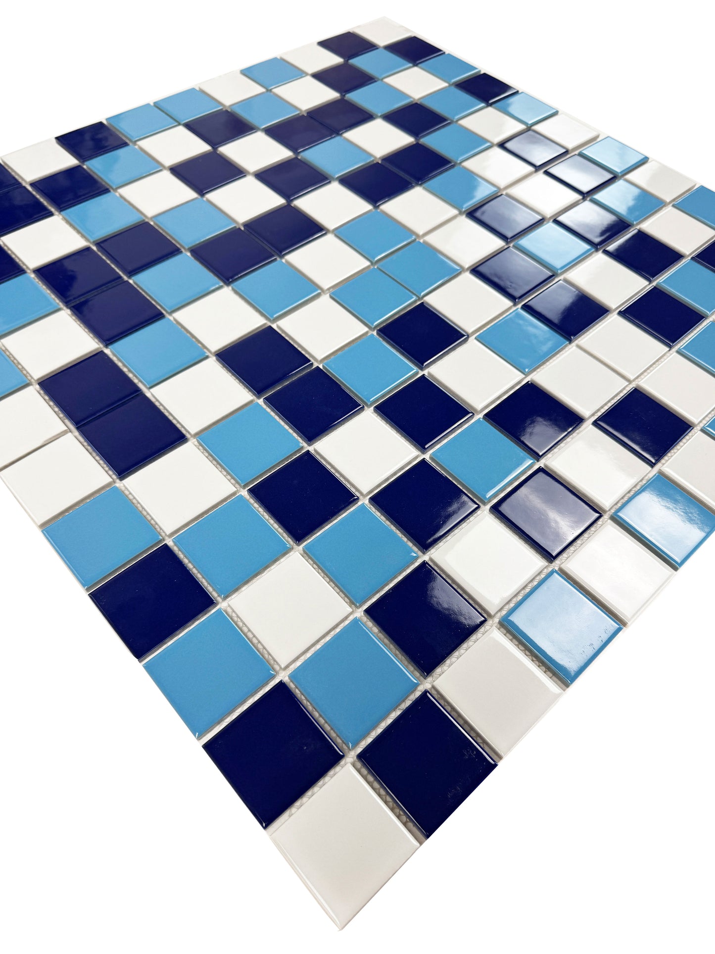 Mosaic tile pattern with blue and white squares on a white background