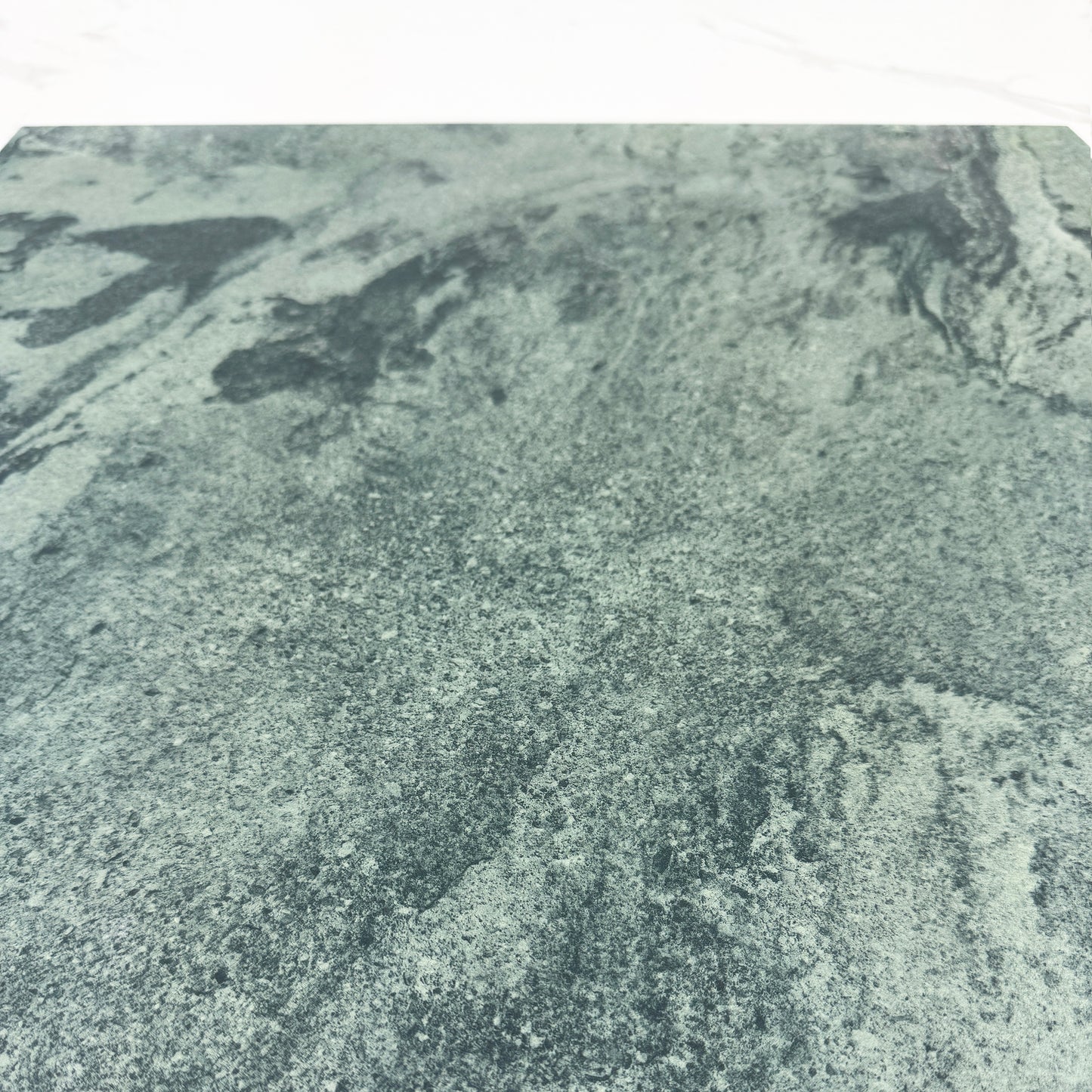 Close-up of a textured green stone surface