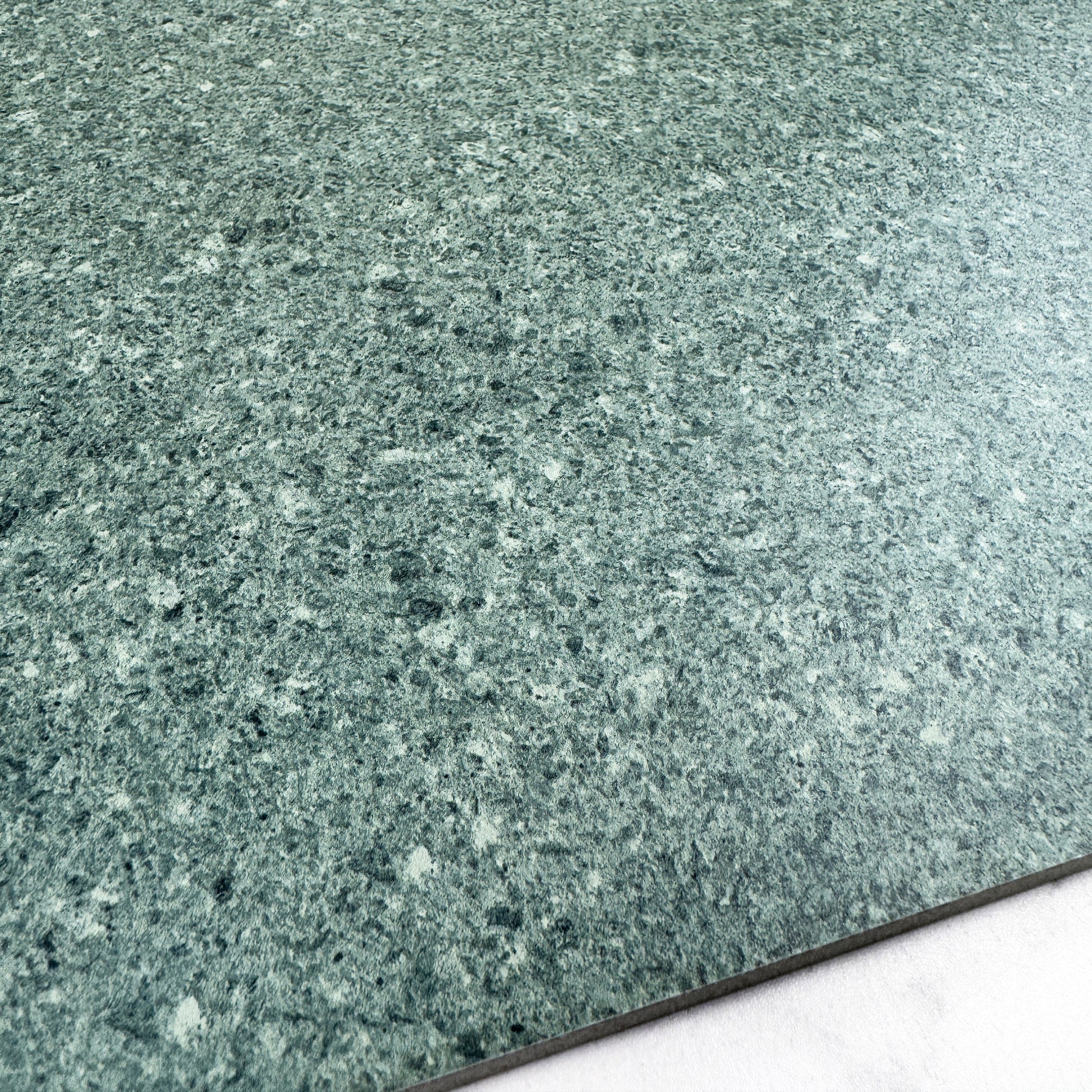 Close-up of a greenish-gray speckled material